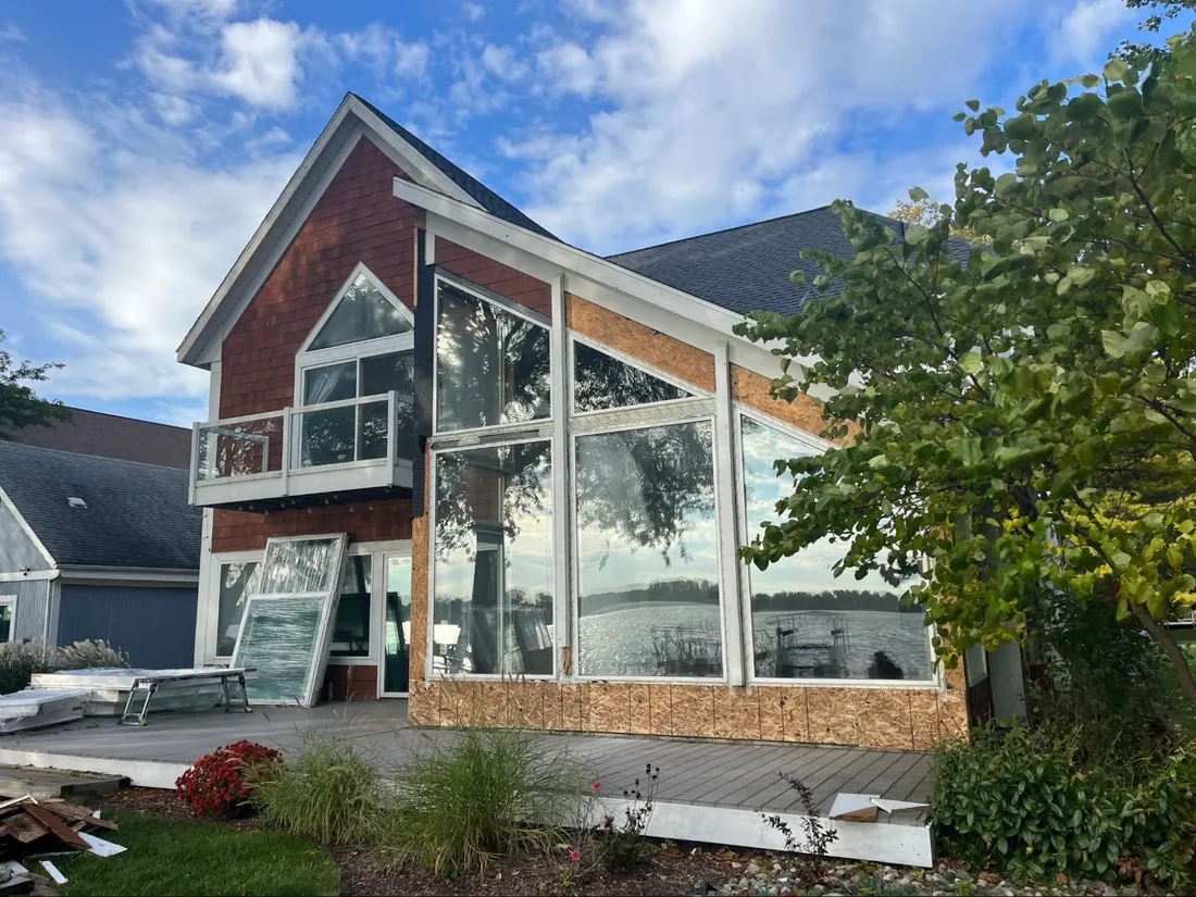 Large lakefront window wall replacement in progress on a Greater Lansing home